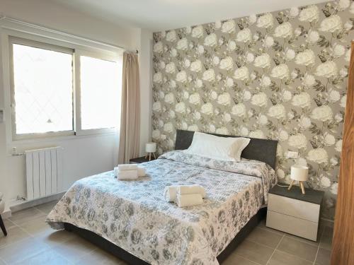 a bedroom with a bed with two boxes on it at Sweet Home Fleming in Rome