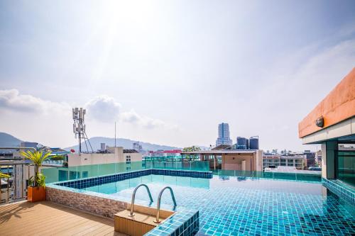 a swimming pool on the roof of a building at Phuket Patong Buri Resort in Patong Beach
