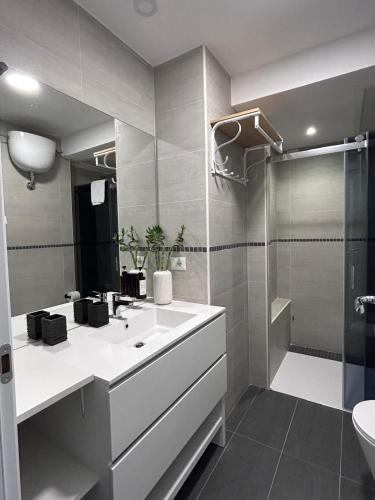 a bathroom with a sink and a shower at Sweet Home Fleming in Rome