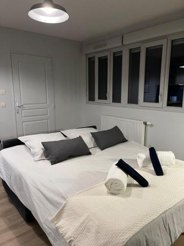 a bedroom with two beds with towels on them at Charmant studio in Villeurbanne