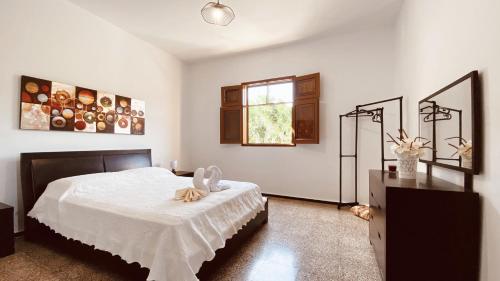 En eller flere senge i et værelse på Vista Pino