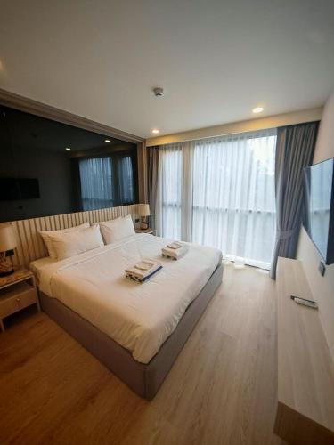 Voodi või voodid majutusasutuse Phuket Family apartment toas