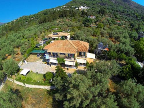 an aerial view of a house on a hill at Alexia Studios in Nydri