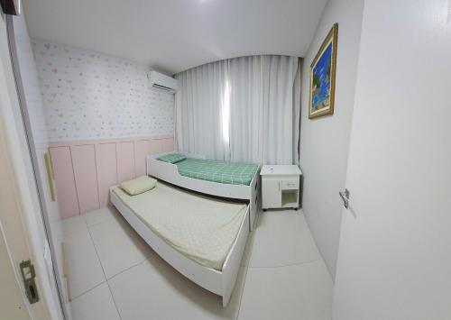 Ένα ή περισσότερα κρεβάτια σε δωμάτιο στο Apartamento 2 quartos vila velha Edifício Jacaranda 101