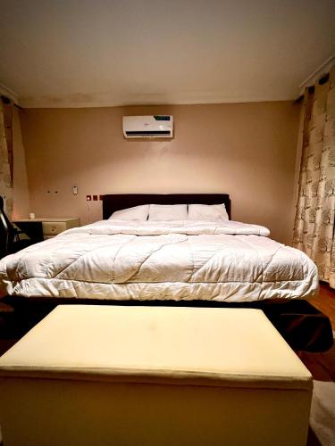 Ένα ή περισσότερα κρεβάτια σε δωμάτιο στο Canaan Apartment