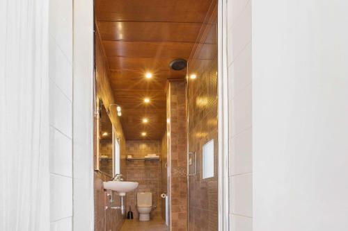 a bathroom with a toilet and a sink at Atic Barcelona in Barcelona