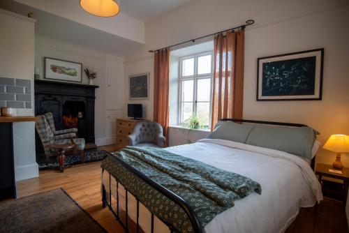 En eller flere senge i et værelse på The Coachmans Quarters