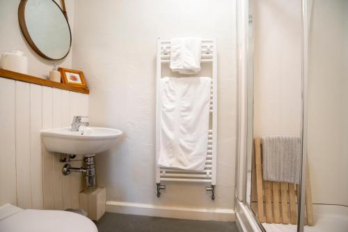 Et badeværelse på The Coachmans Quarters