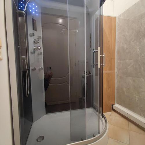 a shower with a glass door in a bathroom at Villa Marina Tsoukalades in Tsoukalades