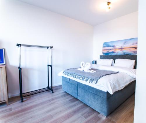 a bedroom with a large bed in a room at Doctor's Cosy Apartment in Lamač
