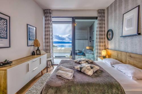 En eller flere senge i et værelse på Apartman Island Beauty 2