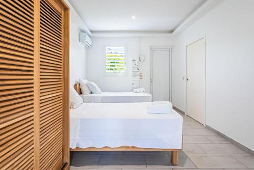 Ένα ή περισσότερα κρεβάτια σε δωμάτιο στο Hibiscus