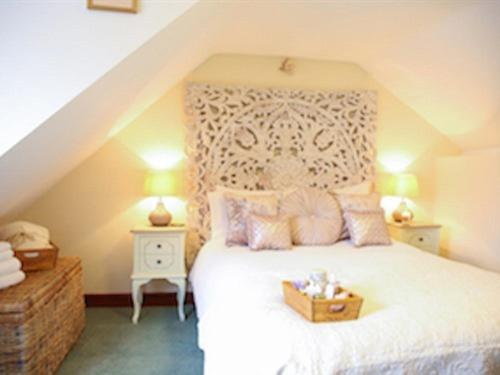 a bedroom with a bed with a box on it at The Shepherd's Purse in Whitby