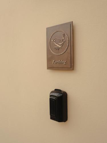 a black object is hanging on a wall at Luxury Apartment with Roof Terrace - Cotswolds in Stow on the Wold