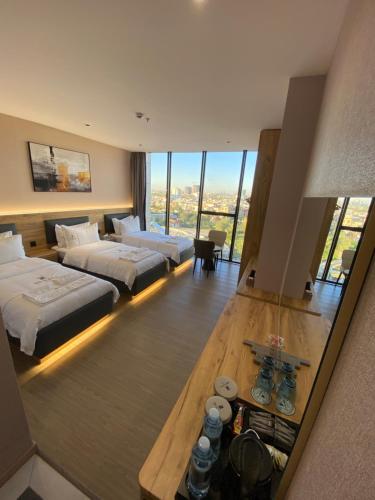 Ένα ή περισσότερα κρεβάτια σε δωμάτιο στο Rek Holiday Hotel