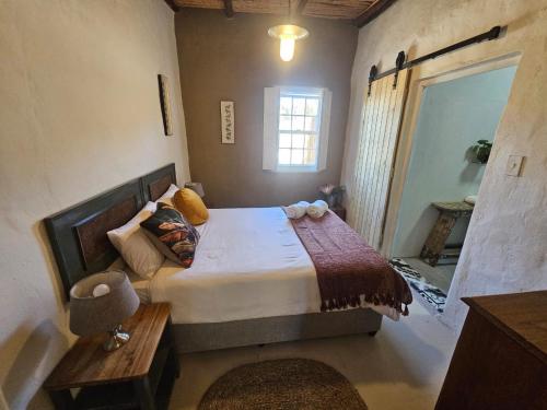 Postel nebo postele na pokoji v ubytování Koringberg Country Cottages