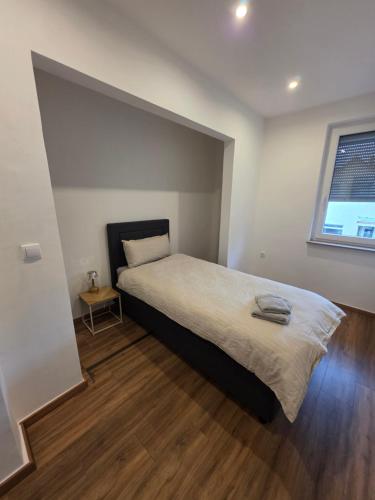 Postel nebo postele na pokoji v ubytování Monteur-& Ferienwohnung -zentral & gemütlich