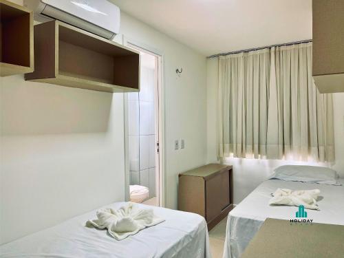 En eller flere senge i et værelse på Golf Ville By Holiday Stays