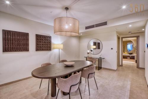 a dining room with a table and chairs at The Rabat Viewpoint Suites by 360 Estates in Ħal-Bajjada