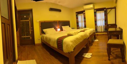 Ένα ή περισσότερα κρεβάτια σε δωμάτιο στο Hotel Nutopia