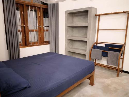 Postel nebo postele na pokoji v ubytování Amandaa Homestay