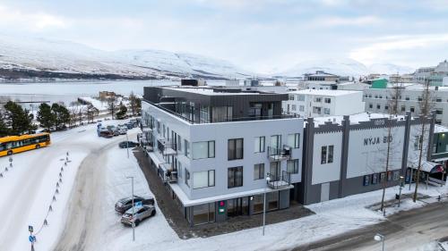an aerial view of a building with a parking lot at New Downtown Retreat in Akureyri