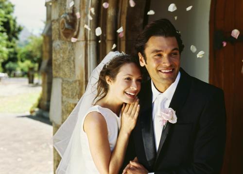 a bride and groom posing for a picture at Country Inn & Suites by Radisson, Ames, IA in Ames