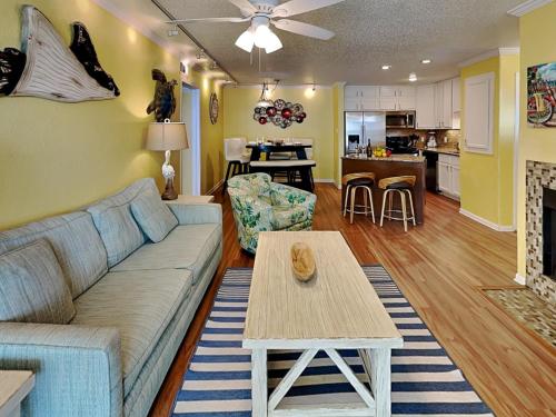 a living room with a couch and a table at Seaside Delight in Mustang Beach