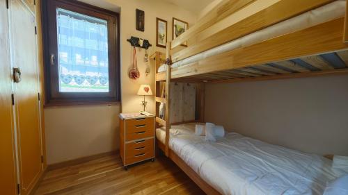 Ένα ή περισσότερα κρεβάτια σε δωμάτιο στο Hostdomus - Pepita Apartment