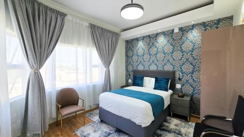 Giường trong phòng chung tại Amherst House