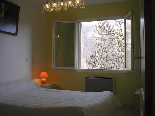 Ένα ή περισσότερα κρεβάτια σε δωμάτιο στο Gentiane - Grust, Vue Panoramique