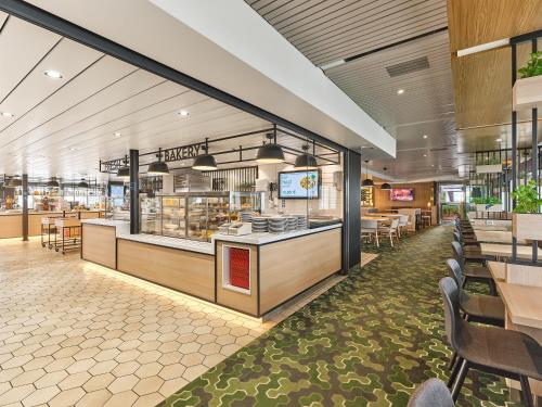 a fast food restaurant with tables and chairs at Tallink ferry -Tallinn 2 nights return cruise to Stockholm in Tallinn