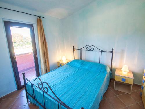 Postel nebo postele na pokoji v ubytování Appartamenti Il Borgo Porto Pollo 400 metri dal mare