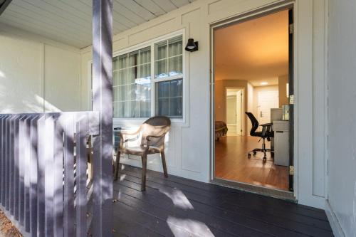 a view of a porch with a chair and a window at Super 8 by Wyndham Gananoque - Country Squire Resort in Gananoque