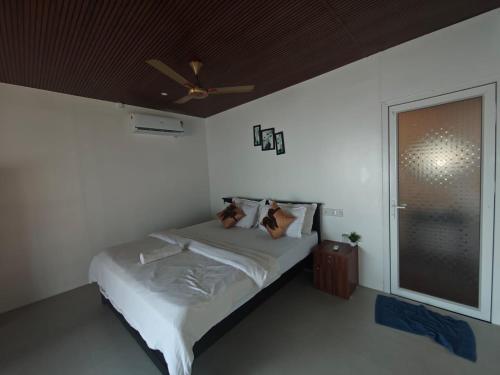 Postel nebo postele na pokoji v ubytování Colomb Beach Huts