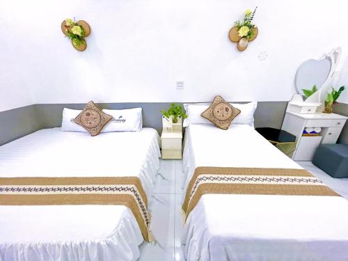 Ένα ή περισσότερα κρεβάτια σε δωμάτιο στο Hoàng Nga 1 Homestay