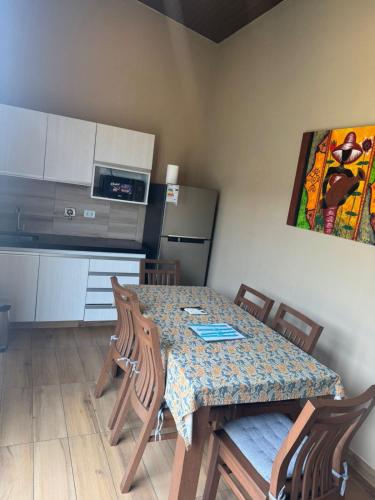 a kitchen with a table and chairs in a room at Mar Adentro Casa 5 in Santa Cruz de la Sierra