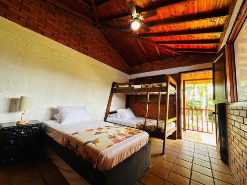 Postel nebo postele na pokoji v ubytování Farm in Montenegro, Quindío