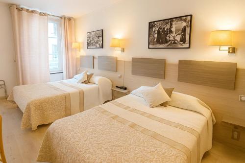 Postel nebo postele na pokoji v ubytování Hôtel du Nord