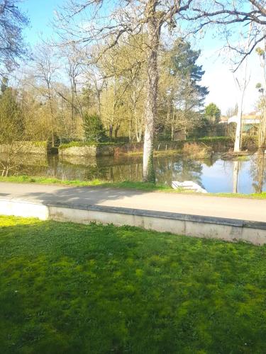 a road next to a body of water at La Carrière in Pont-Saint-Martin