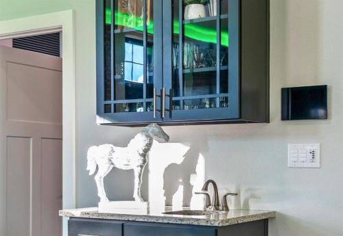 a statue of a horse on a kitchen counter at Chic Downtown Retreat Fireplace Game Area in Hot Springs