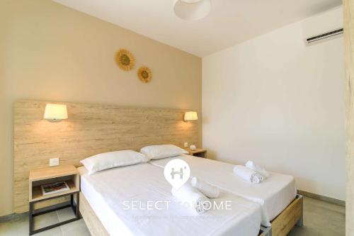 Voodi või voodid majutusasutuse SELECT'soHOME - T3 - Résidence avec piscine et cascade ! - CAPNAT-C03 toas