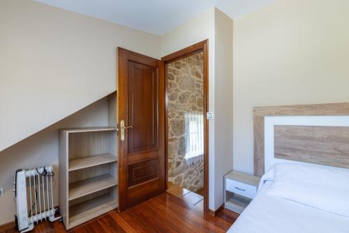 Ένα ή περισσότερα κρεβάτια σε δωμάτιο στο Casa Abuela Mercedes