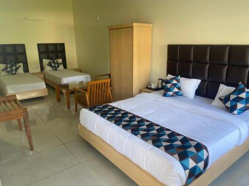 Postel nebo postele na pokoji v ubytování Great Tiger Resort