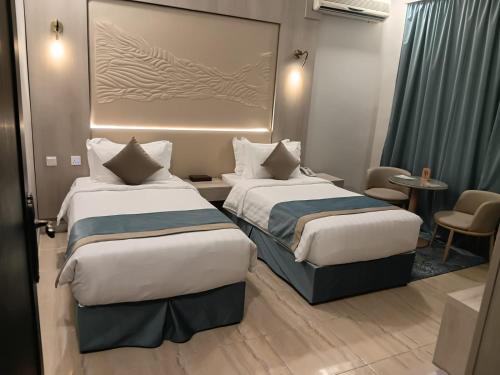 Ένα ή περισσότερα κρεβάτια σε δωμάτιο στο The High View Hotel - ذا هاي فيو