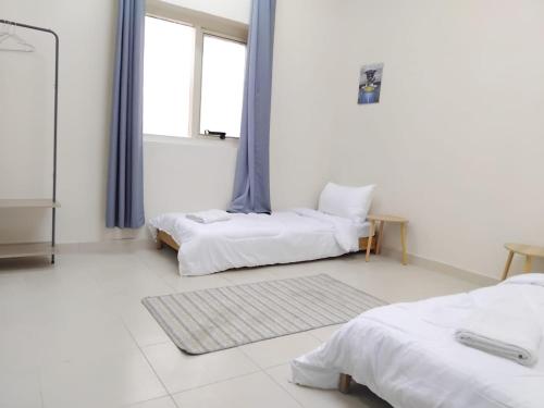 Voodi või voodid majutusasutuse MANAZEL2 ladies and Family stay only corniche apartment toas