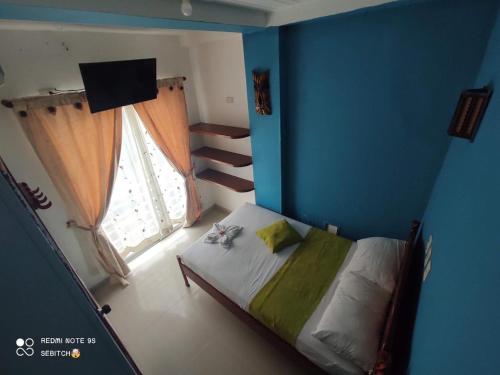 Ένα ή περισσότερα κρεβάτια σε δωμάτιο στο anyros plaza hotel