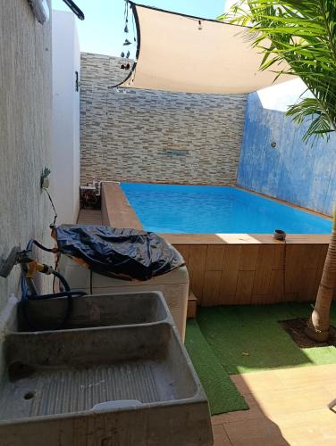 a swimming pool next to a large blue pool at Casa Montiel in Mérida