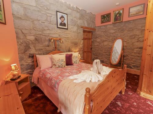 Postel nebo postele na pokoji v ubytování Coole Gate Lodge