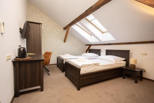 Ένα ή περισσότερα κρεβάτια σε δωμάτιο στο Apartmány na Bašte